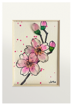 Cuadro con dibujo de rama de almendro con flores de tinta y acuarela con vidrio de mar resaltando los pétalos y los capullos