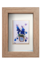 Maceta de flores lilas