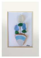 Maceta con flores blancas y azules