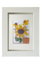 Auringonkukkia ruukuissa